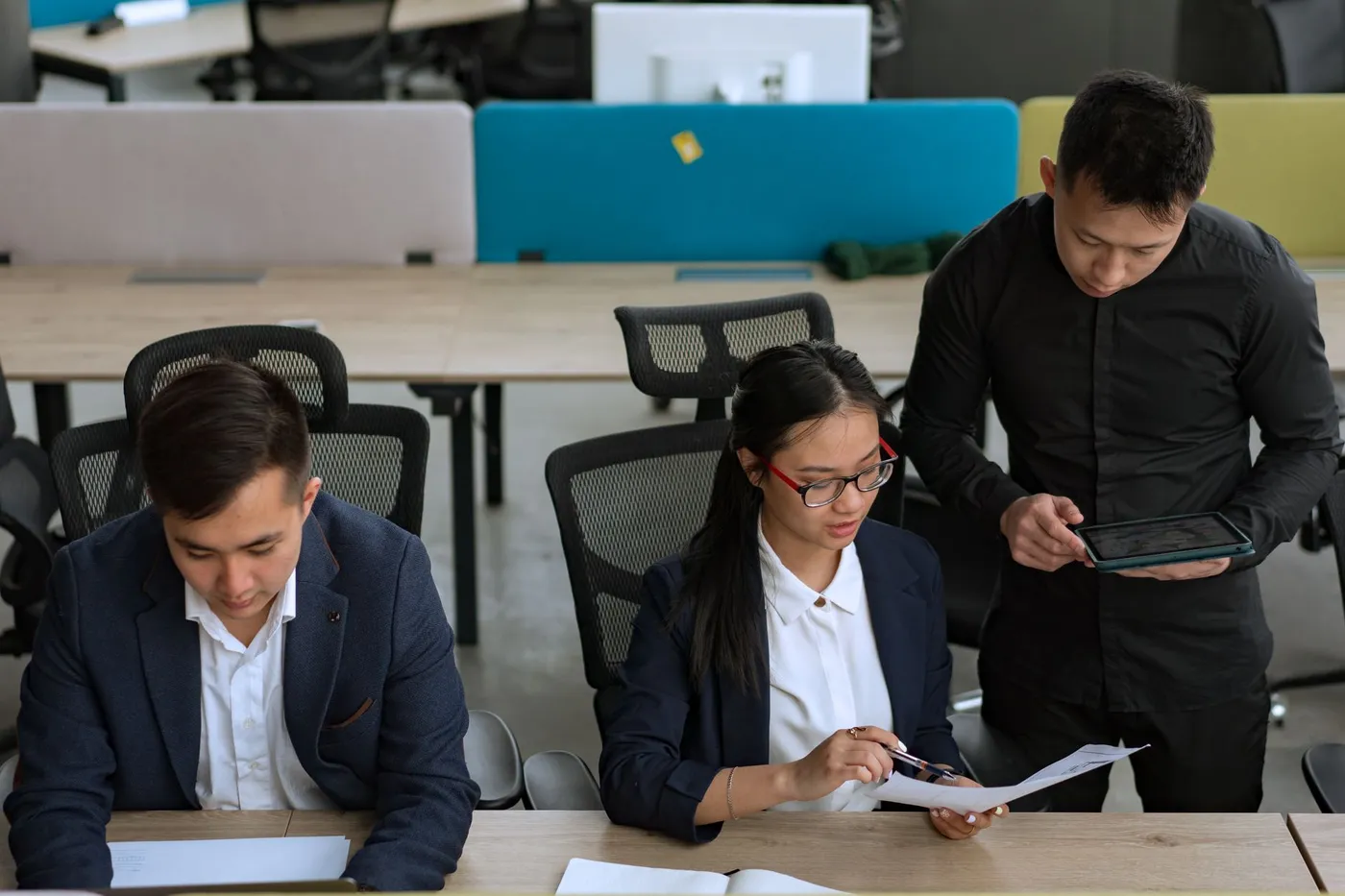 Team collaborating in a modern open-plan technology office